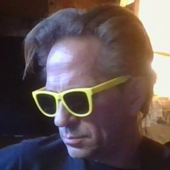Portrait of rjhugginsruff wearing yellow sunglasses